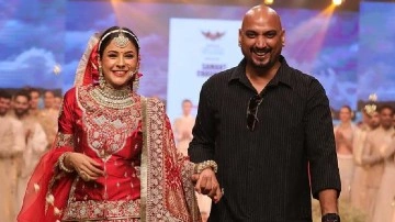 Shehnaaz Gill debuts her ramp walk in Red bridal lehenga and shy smile